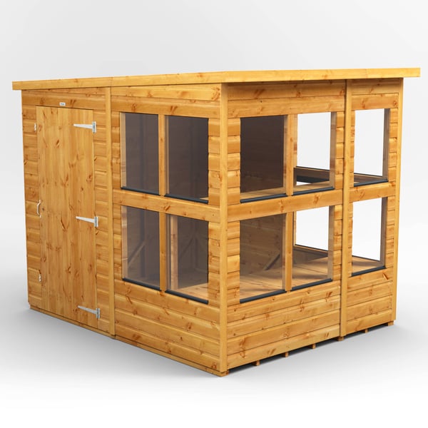 Low-profile Power pent potting shed for a boundary-conscious garden layout